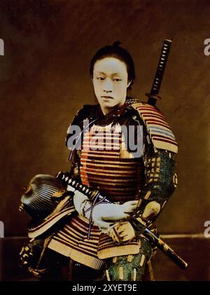 Portrait of Samurai in armour 1873-1875 by Suzuki Shin`ichi I .his is a Japanese hand-coloured black-and-white photo from the late 19th to the beginning of the 20th century. It is a vintage albumen photograph, digitally improved. Japanese hand-coloured black-and-white photo Japan late 19th—beginning of 20th-century vintage albumen photograph ( Historic History ) digitally enhanced reproduction. Stock Photo